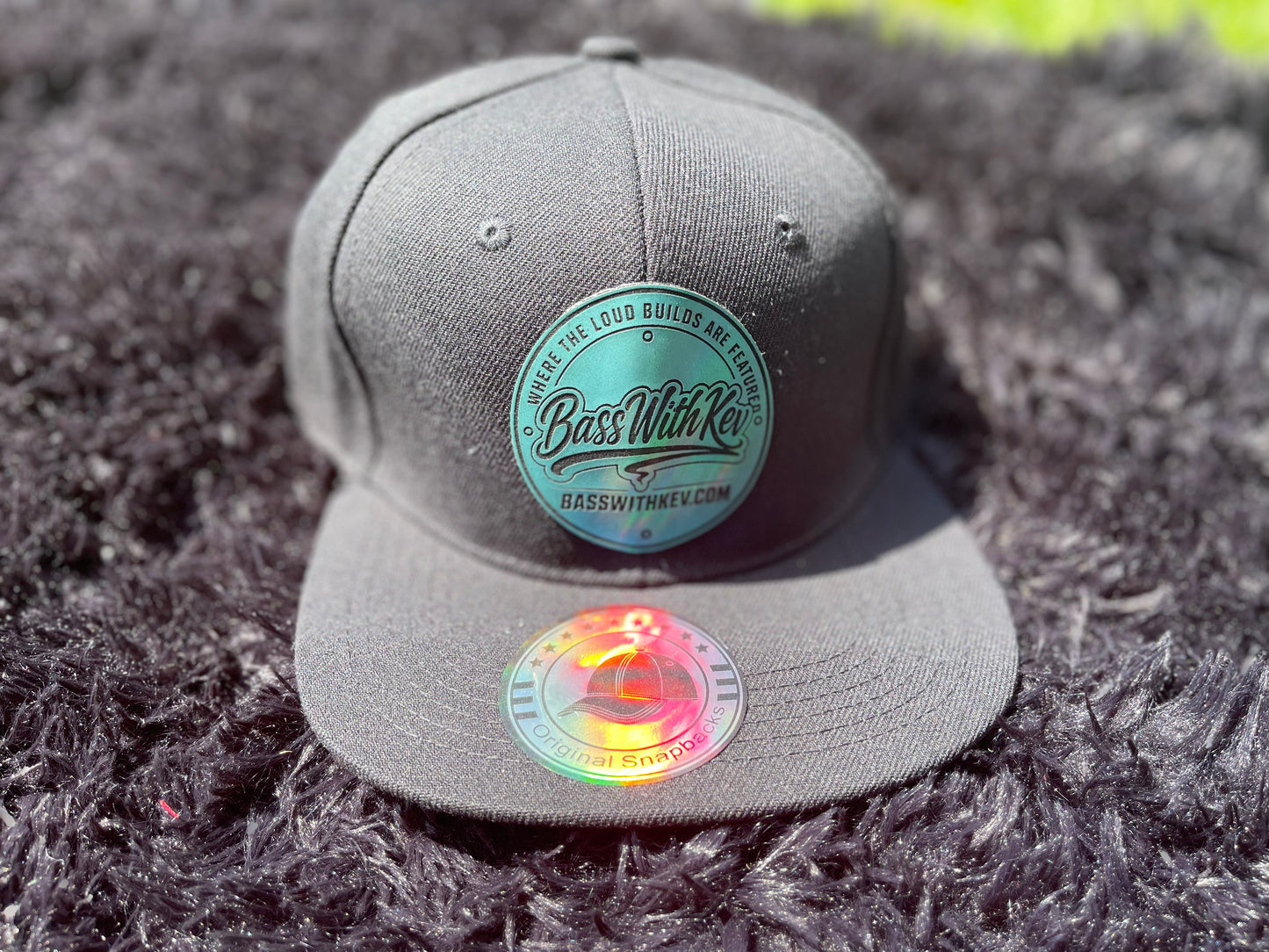 BASSWITHKEV BLACK FLAT BILL SNAPBACK HAT TEAL BADGE